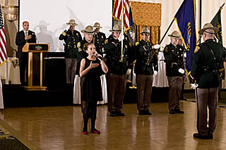 lady singing National Anthem