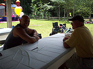 men visiting at the picnic