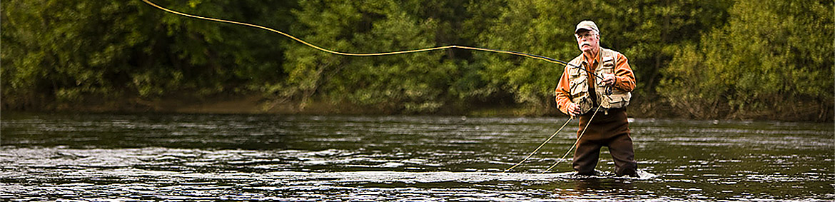 man flyfishing in a river