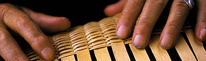 closeup of hands on a basket weave