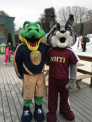 investi'gator' mascot standing with nhti mascot