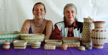 (left) Apprentice Denise Pouliot (right) master artist Sherry Gould surrounded by their baskets