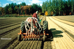 a tractor howing a field bed