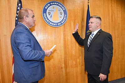 Photo of New Hampshire Department of Safety Commissioner Robert Quinn swearing in Robert Buxton as director of the Division of Homeland Security and Emergency Management.