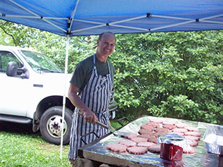 Jeff Kellett cooking hamburgers close-up